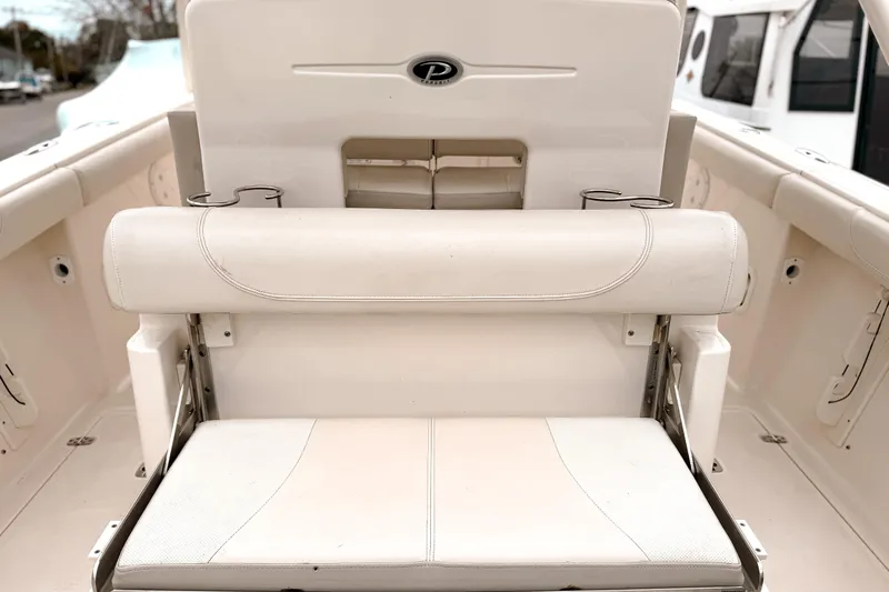  Yacht Photos Pics 2014 Pursuit S 280 Sport boat interior with white seating and cup holders.