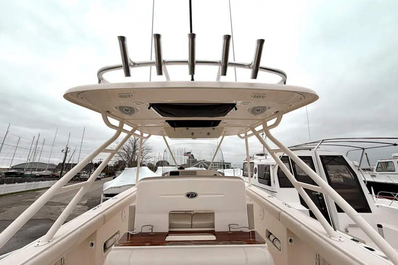  Yacht Photos Pics 2014 Pursuit S 280 Sport boat interior with T-top and rod holders.