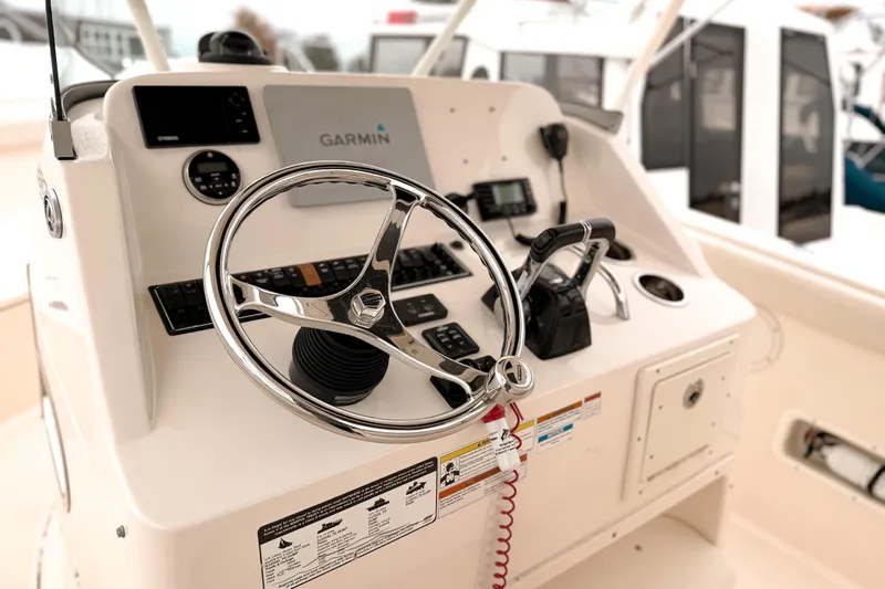  Yacht Photos Pics Control panel of 2014 Pursuit S 280 Sport boat with Garmin navigation system.