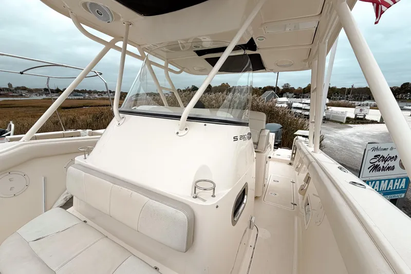  Yacht Photos Pics 2014 Pursuit S 280 Sport boat interior at Striper Marina, featuring seating and helm.