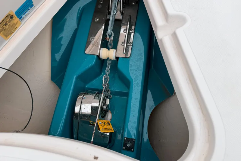  Yacht Photos Pics Anchor compartment of 2014 Pursuit S 280 Sport boat, featuring chain and winch.