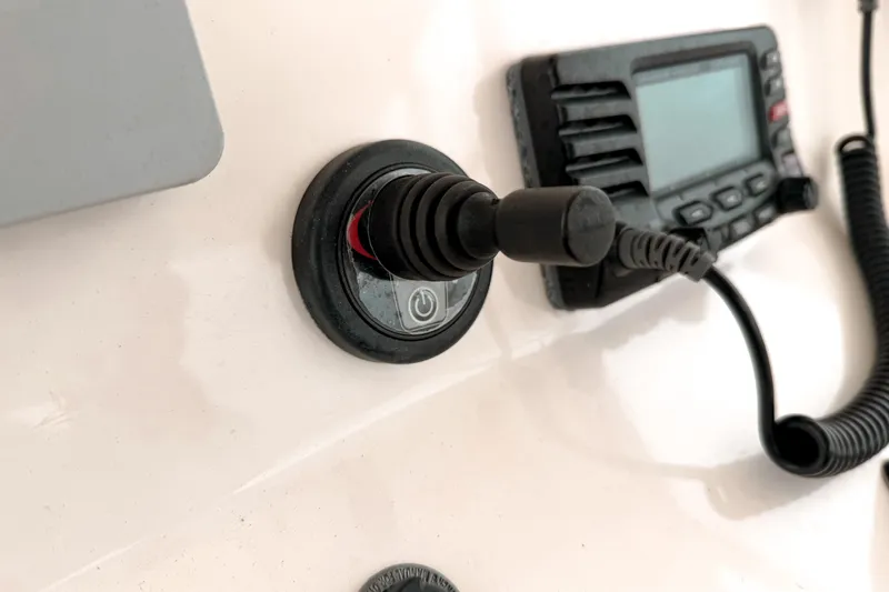  Yacht Photos Pics Control panel of a 2014 Pursuit S 280 Sport boat with joystick and radio.