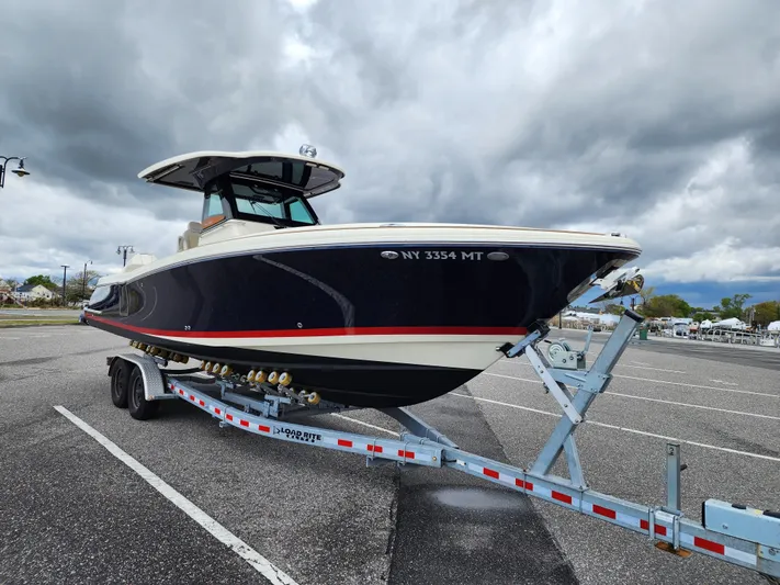 Sea Senora Yacht Photos Pics 2022 Chris-Craft Catalina 30 boat on a trailer in a parking lot.