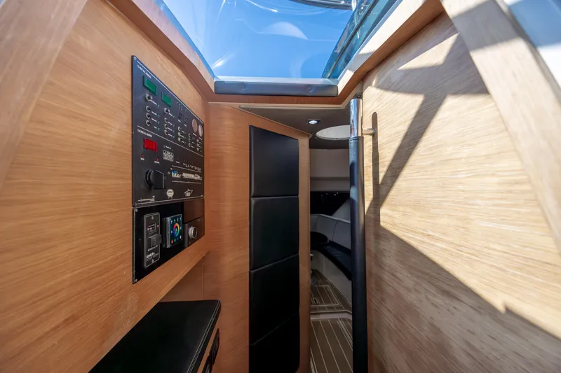  Yacht Photos Pics Interior of 2009 Sessa Marine Key Largo 36, featuring control panel and modern wood finish.