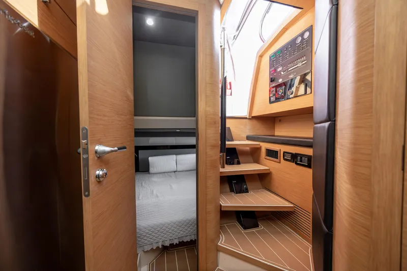  Yacht Photos Pics Interior of 2009 Sessa Marine Key Largo 36, featuring cabin and wooden stairs.