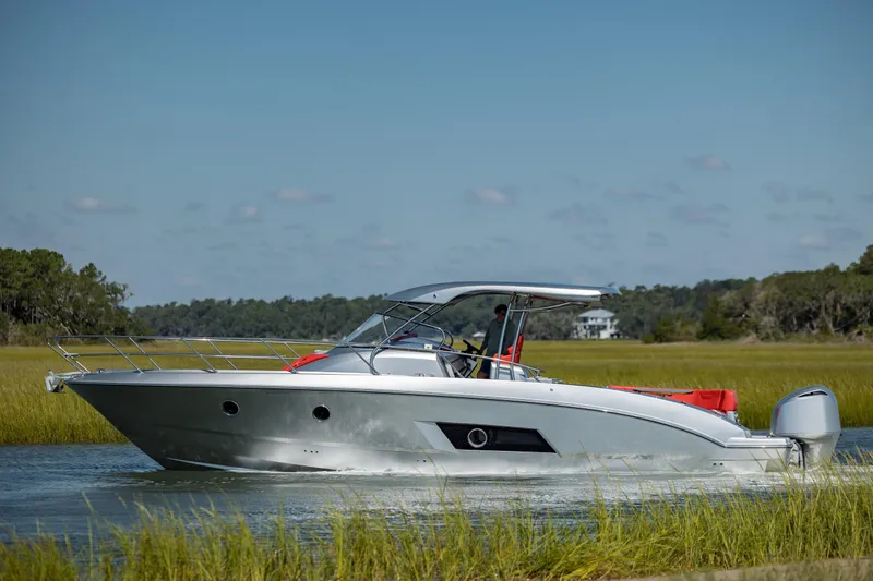  Yacht Photos Pics 2009 Sessa Marine Key Largo 36 cruising on a serene waterway.