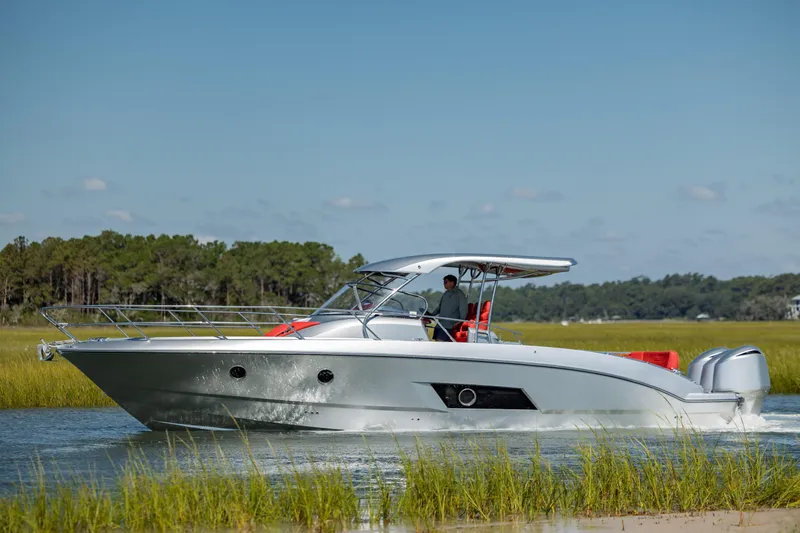  Yacht Photos Pics 2009 Sessa Marine Key Largo 36 cruising on a serene waterway.