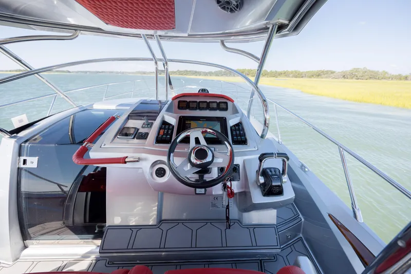  Yacht Photos Pics 2009 Sessa Marine Key Largo 36 helm with modern controls on open water.