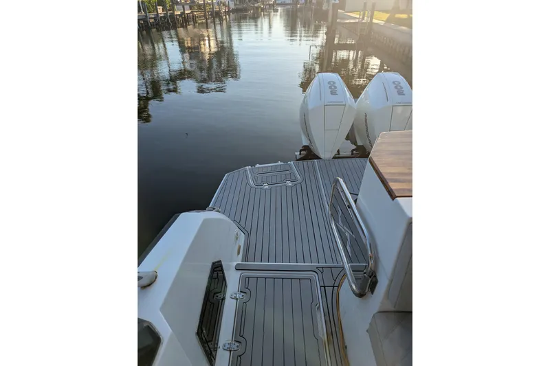 Mbvip Yacht Photos Pics 2023 NX Boats 340 Sport Coupe docked with twin outboard engines.