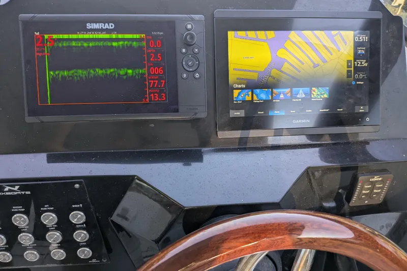 Mbvip Yacht Photos Pics Dashboard of 2023 NX Boats 340 Sport Coupe with Simrad and Garmin displays.