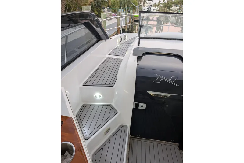 Mbvip Yacht Photos Pics 2023 NX Boats 340 Sport Coupe deck with sleek design and modern features.