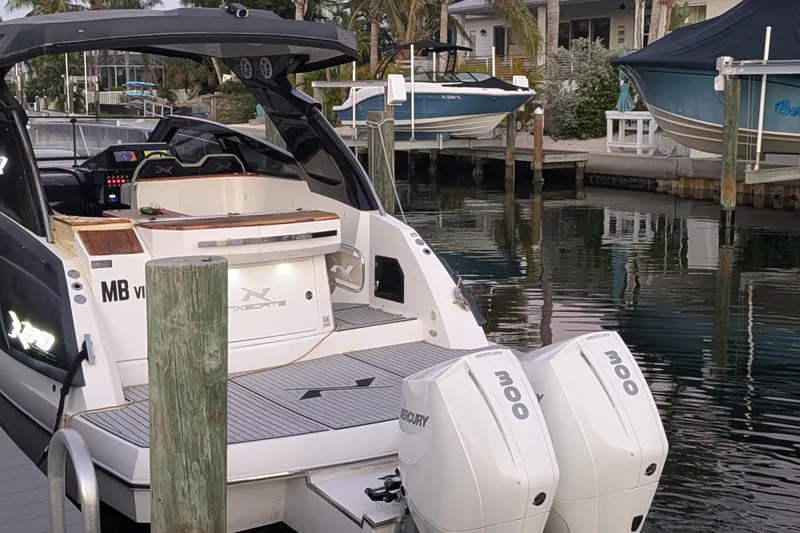Mbvip Yacht Photos Pics 2023 NX Boats 340 Sport Coupe docked with twin Mercury 300 engines.