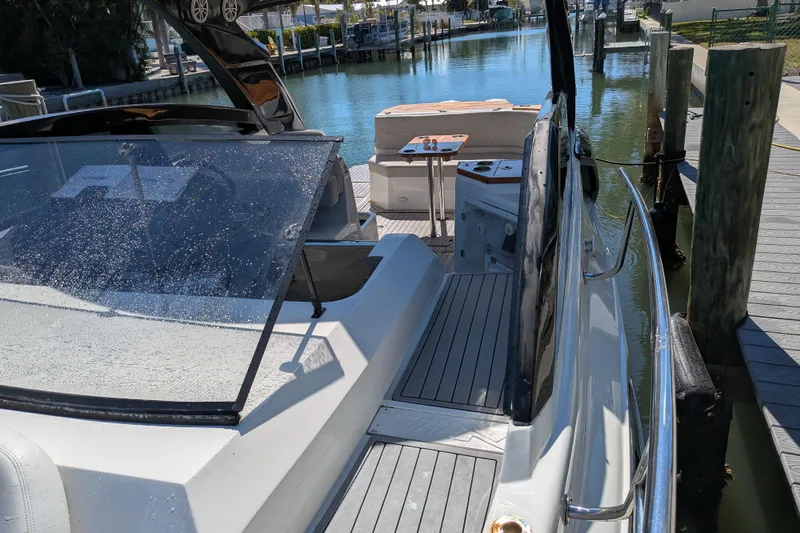 Mbvip Yacht Photos Pics 2023 NX Boats 340 Sport Coupe docked, showcasing sleek design and modern features.