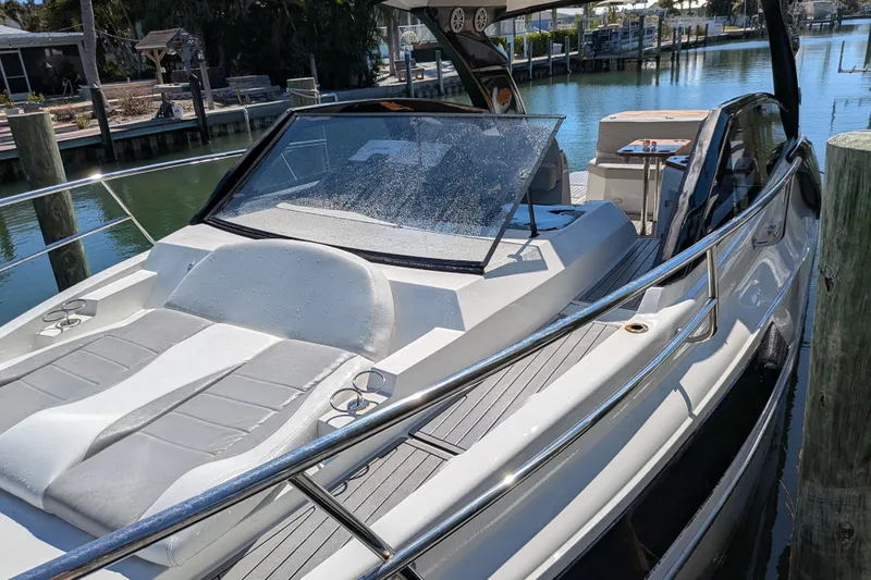 Mbvip Yacht Photos Pics 2023 NX Boats 340 Sport Coupe docked, featuring sleek design and spacious deck.