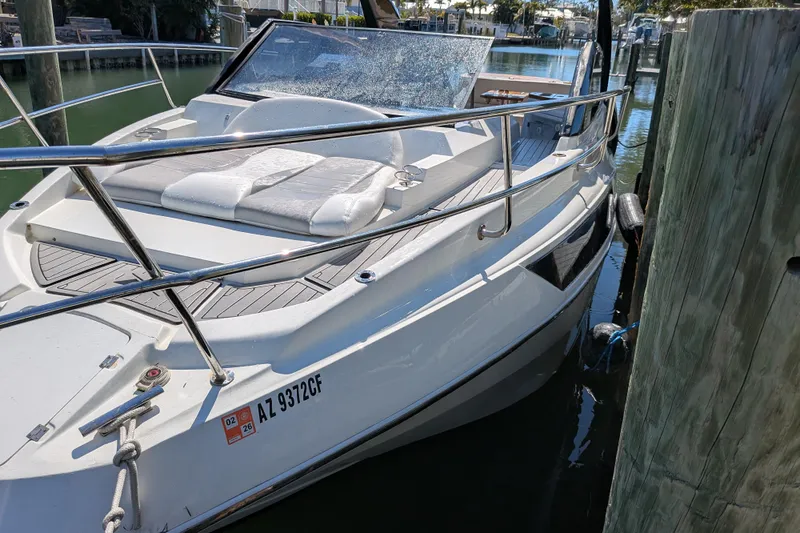 Mbvip Yacht Photos Pics 2023 NX Boats 340 Sport Coupe docked, featuring sleek design and comfortable seating.