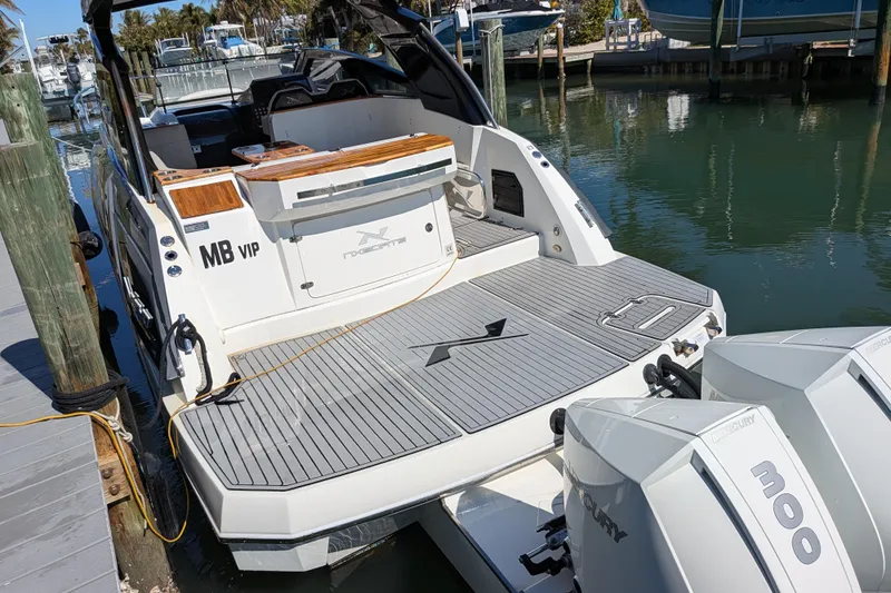 Mbvip Yacht Photos Pics 2023 NX Boats 340 Sport Coupe docked with twin Mercury 300 engines.