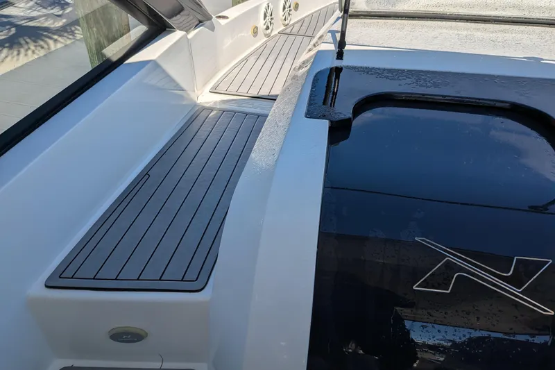 Mbvip Yacht Photos Pics 2023 NX Boats 340 Sport Coupe deck with sleek design and modern features.
