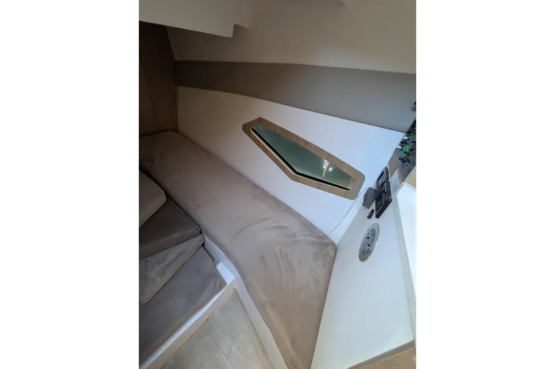 Mbvip Yacht Photos Pics Interior of 2023 NX Boats 340 Sport Coupe with beige seating and modern design.