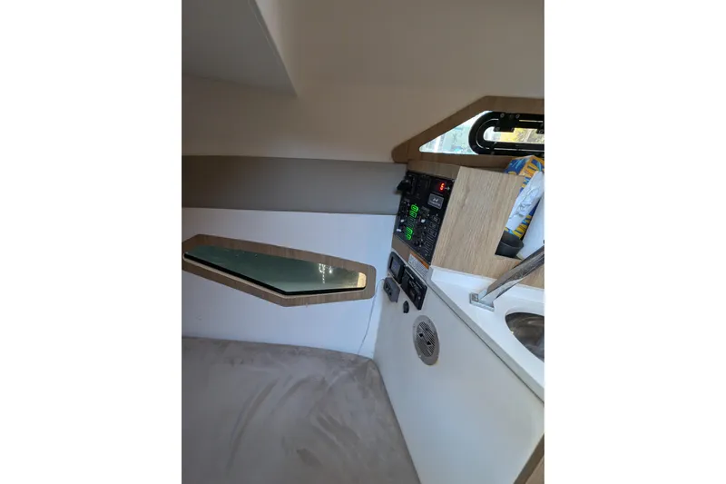 Mbvip Yacht Photos Pics Interior of 2023 NX Boats 340 Sport Coupe, featuring control panel and modern design elements.