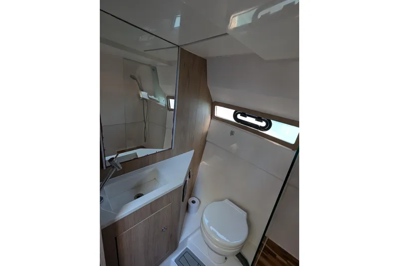 Mbvip Yacht Photos Pics 2023 NX Boats 340 Sport Coupe bathroom with modern fixtures and sleek design.