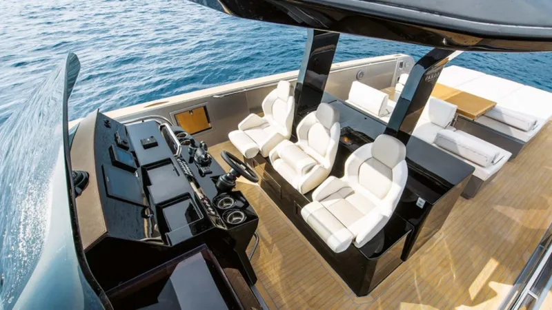 Yaaas Yacht Photos Pics Luxury 2024 Pardo Yachts P43 interior with sleek seating and modern helm, cruising on open water.