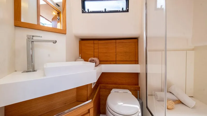 Yaaas Yacht Photos Pics Luxurious bathroom in 2024 Pardo Yachts P43, featuring modern sink and shower.