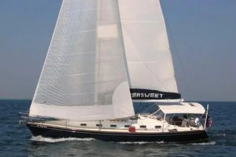 Bittersweet Yacht Photos Pics Sailing yacht Tartan 4100, 1989 model, cruising on open sea with full sails.