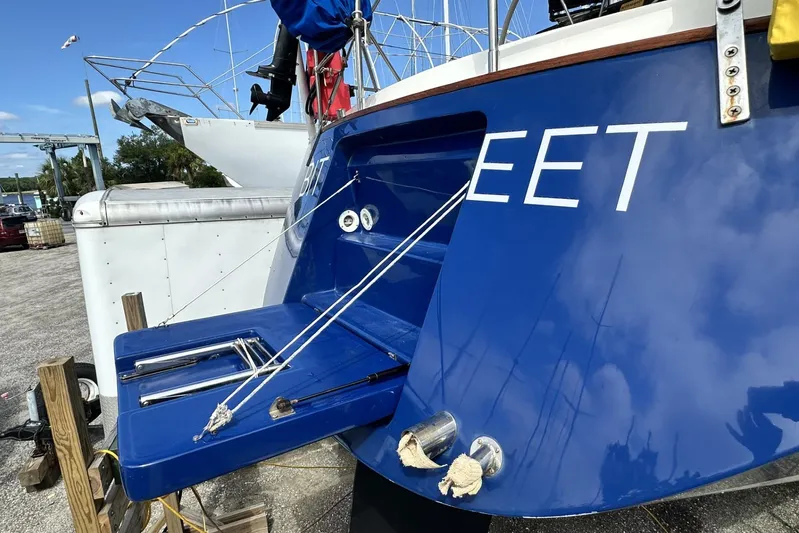 Bittersweet Yacht Photos Pics Blue 1998 Tartan 4100 sailboat stern with swim platform and docked setting.