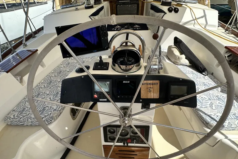 Bittersweet Yacht Photos Pics Cockpit of 1998 Tartan 4100 sailboat with steering wheel and navigation instruments.