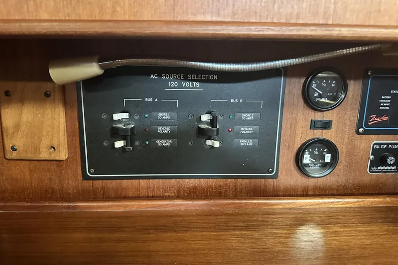 Bittersweet Yacht Photos Pics Electrical panel on a 1998 Tartan 4100 sailboat, featuring AC source selection and gauges.
