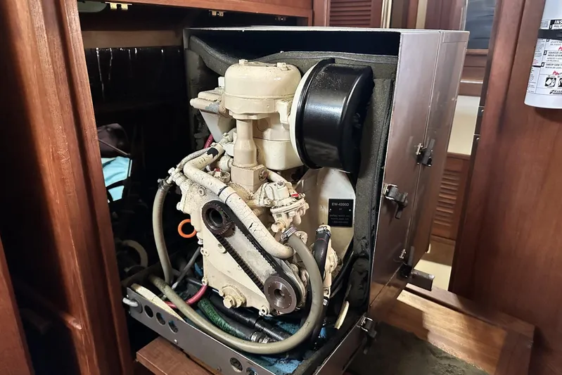 Bittersweet Yacht Photos Pics Engine compartment of a 1998 Tartan 4100 sailboat, showcasing mechanical components.