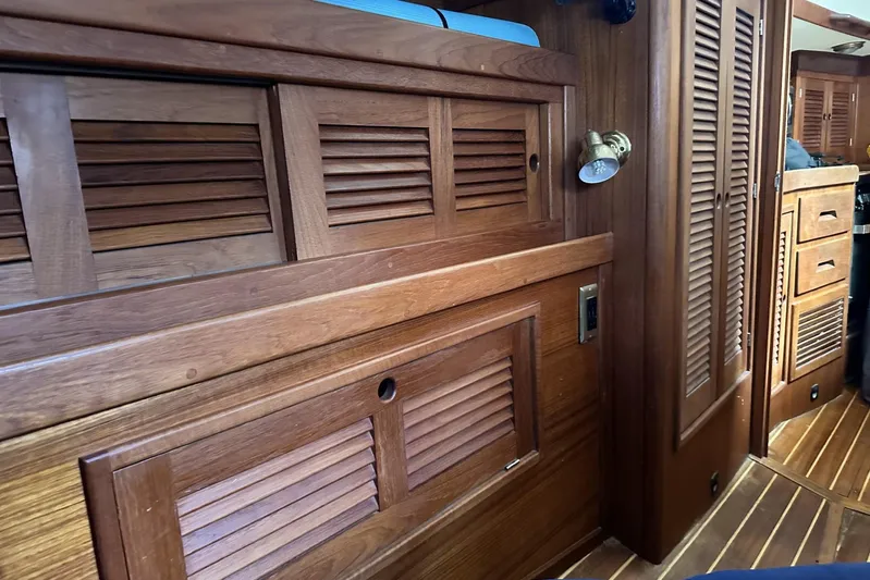 Bittersweet Yacht Photos Pics Interior of a 1998 Tartan 4100 sailboat with wooden cabinetry and flooring.