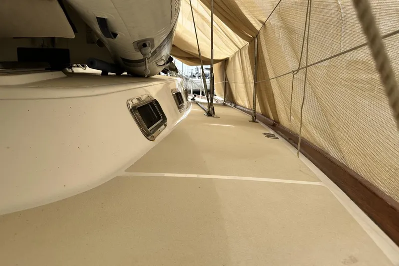 Bittersweet Yacht Photos Pics 1998 Tartan 4100 yacht deck under protective cover, showcasing sleek design.