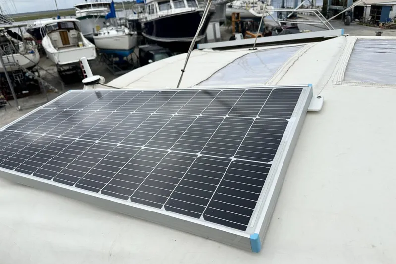 Bittersweet Yacht Photos Pics Solar panel on 1998 Tartan 4100 yacht, docked with other boats in the background.