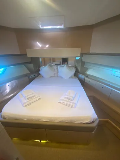  Yacht Photos Pics Luxurious bedroom interior of 2012 Ferretti Yachts 720 with neatly arranged bed and pillows.