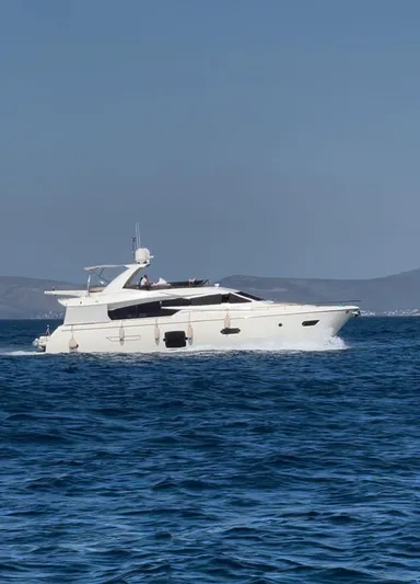  Yacht Photos Pics 2012 Ferretti Yachts 720 cruising on open sea with distant hills in background.