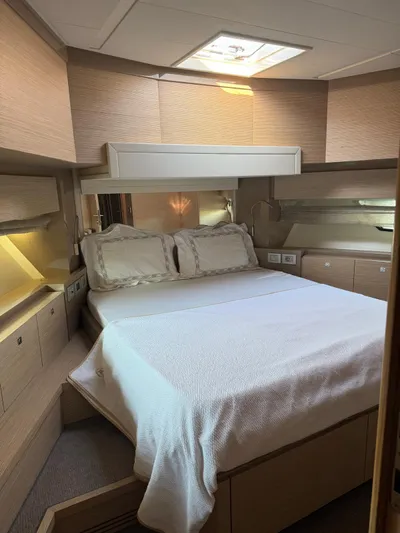  Yacht Photos Pics Luxurious bedroom interior of 2012 Ferretti Yachts 720 with elegant bedding and wood finishes.