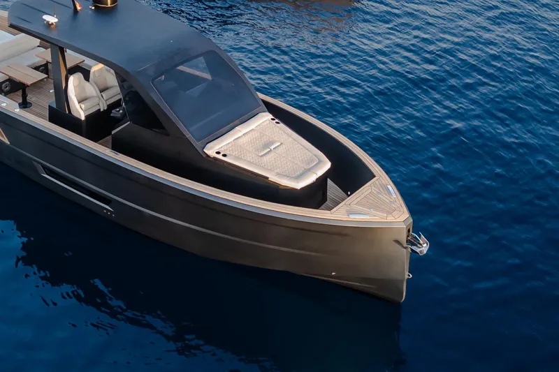 Maxim Yachts | Max43 Race Yacht Photos Pics Sleek 2026 Maxim Yachts 43 on calm blue water, showcasing modern design.