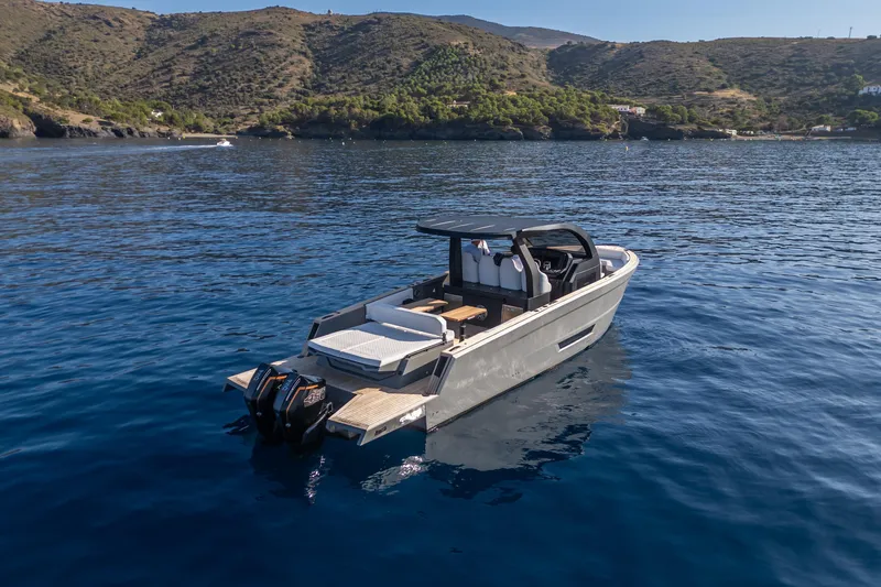 Maxim Yachts | Max43 Race Yacht Photos Pics Modern 2026 Maxim Yachts 43 on serene blue waters, scenic coastal backdrop.
