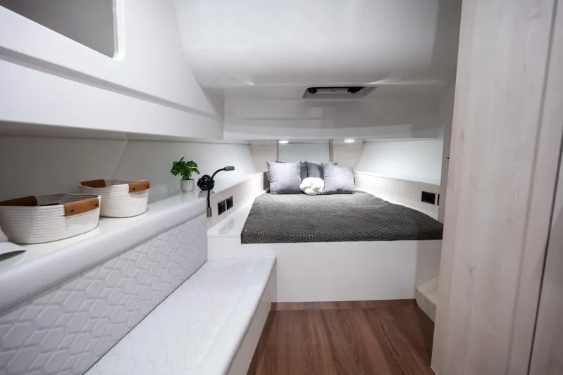 Maxim Yachts | Max43 Race Yacht Photos Pics Luxurious cabin interior of 2026 Maxim Yachts 43 Race, featuring cozy bed and modern decor.
