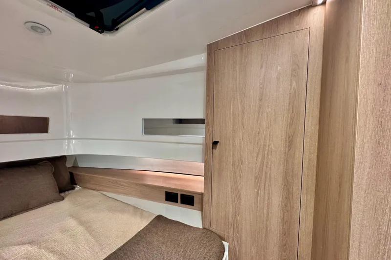 Maxim Yachts | Max43 Race Yacht Photos Pics Luxurious cabin interior of 2026 Maxim Yachts 43 Race, featuring modern wood finishes.