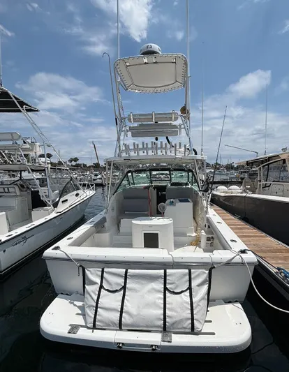 Marisol Yacht Photos Pics 2006 Tiara Yachts 2900 boat docked at marina under a partly cloudy sky.