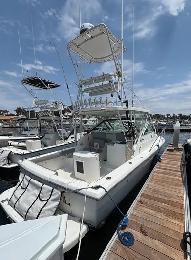 Marisol Yacht Photos Pics 2006 Tiara Yachts 2900 docked at marina under clear sky.