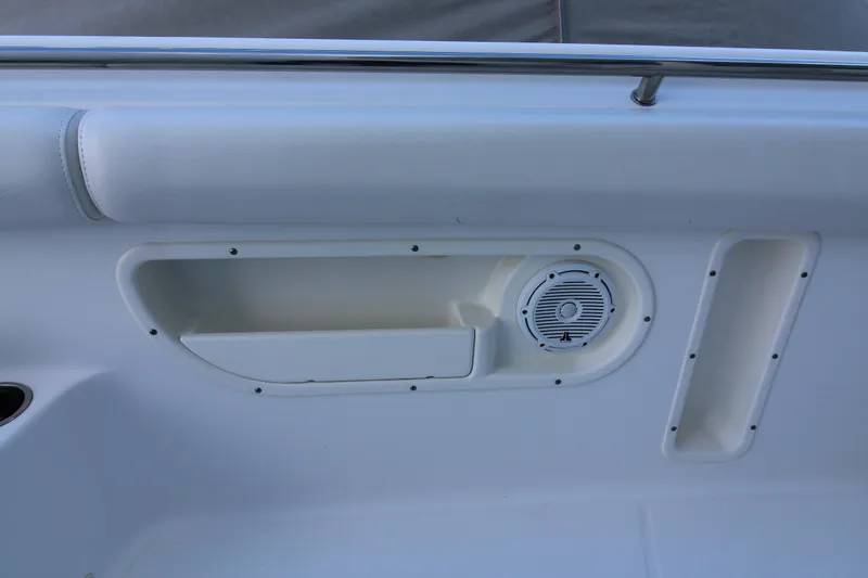 Better Than Most Yacht Photos Pics Interior detail of 2015 Boston Whaler 320 Outrage boat, featuring speaker and storage compartment.