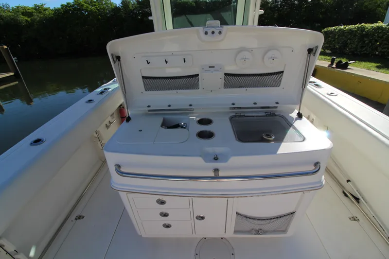 Better Than Most Yacht Photos Pics 2015 Boston Whaler 320 Outrage boat interior with open storage and sink.