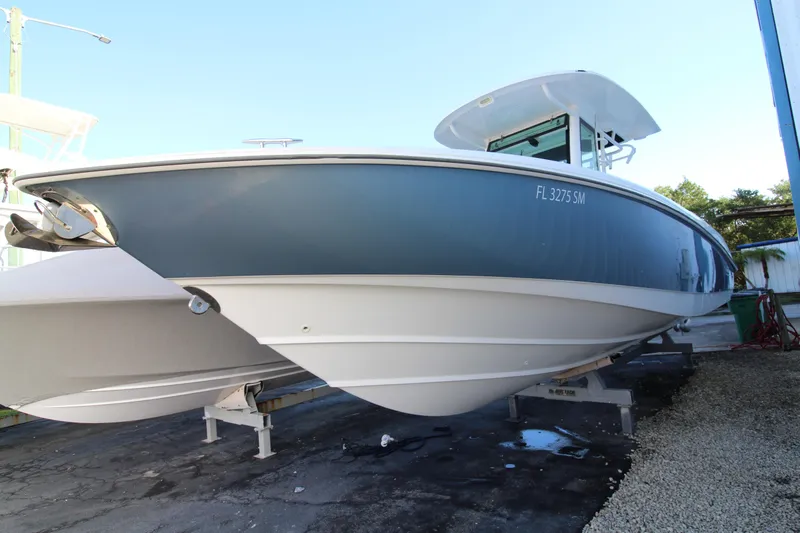 Better Than Most Yacht Photos Pics 2015 Boston Whaler 320 Outrage boat on display, side view.