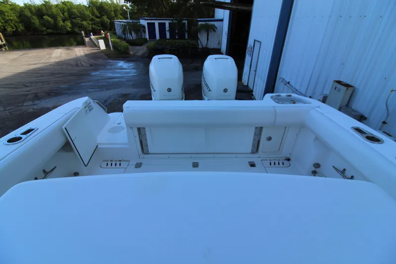 Better Than Most Yacht Photos Pics 2015 Boston Whaler 320 Outrage boat with dual outboard engines at dockside.