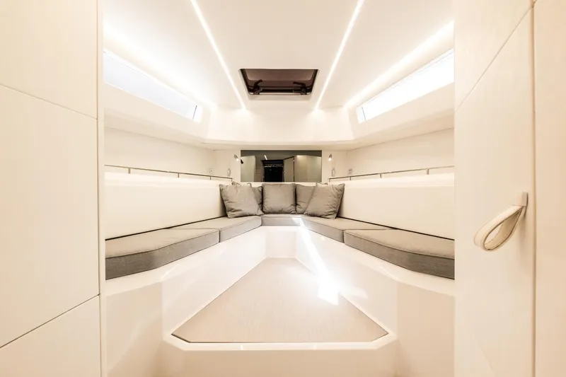 Mistral Yacht Photos Pics Luxurious interior of 2023 Evo Yachts R4 XT with modern seating and ambient lighting.