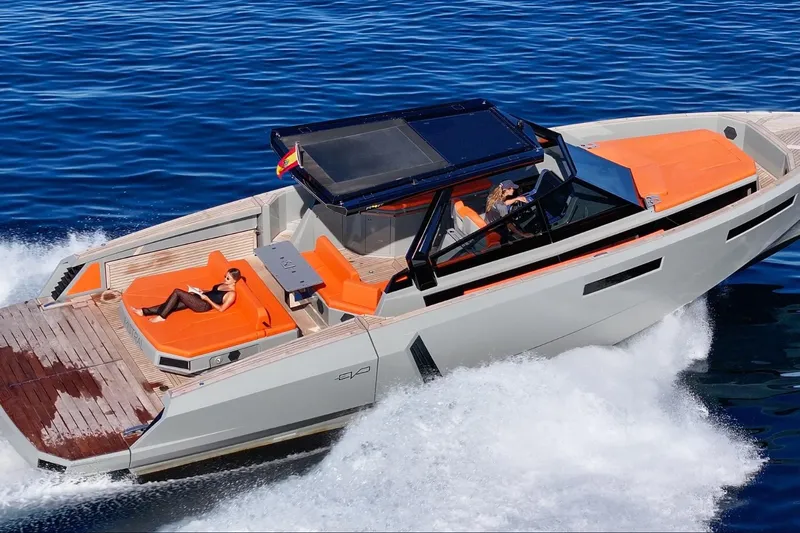 Mistral Yacht Photos Pics 2023 Evo Yachts R4 XT cruising on blue ocean with sunbathing area.