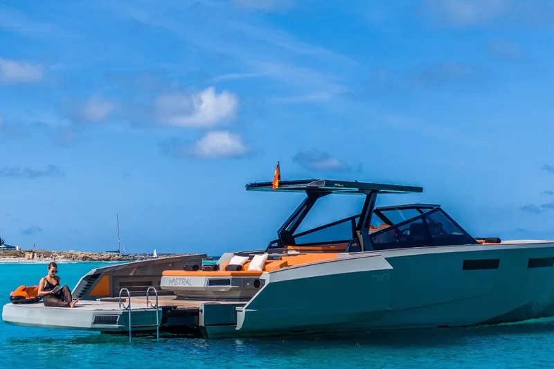 Mistral Yacht Photos Pics 2023 Evo Yachts R4 XT luxury yacht on clear blue water, sunny day.